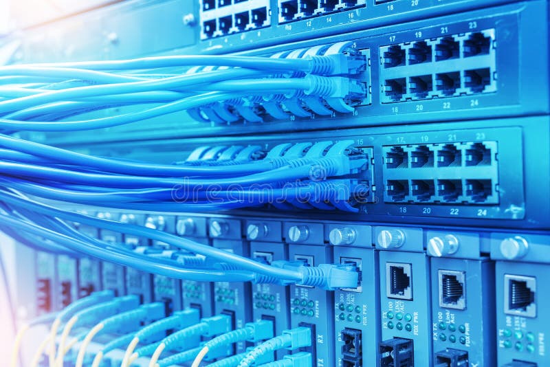 Network cables and hub closeup with fiber optical royalty free stock photos