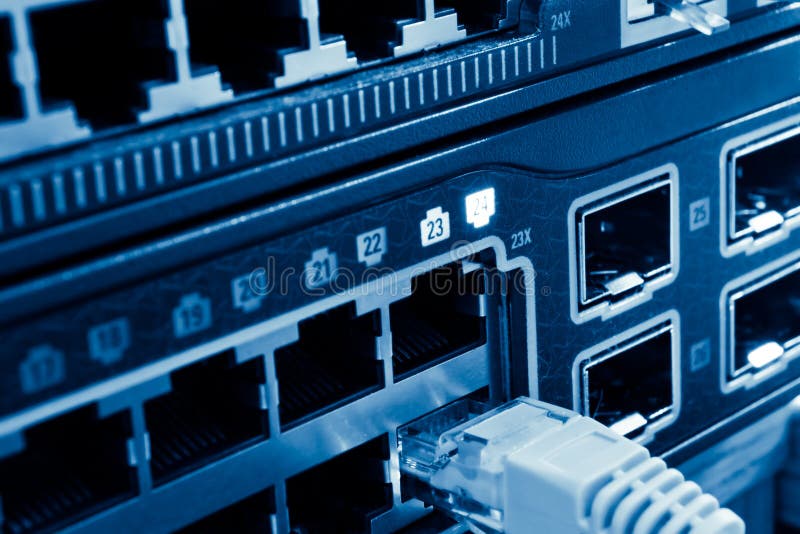 Network hub. Network cable and hub in data center Network hub. Network cable and hub in data center