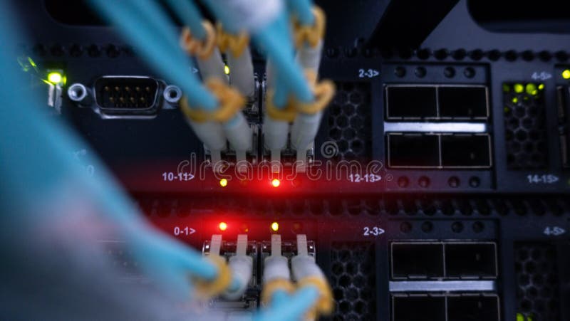 Network optic fiber cables and switch close-up stock image Network optic fiber cables and switch close-up stock image
