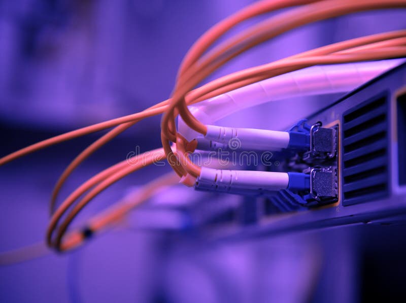 Network optical fiber cables and hub stock image Network optical fiber cables and hub stock image