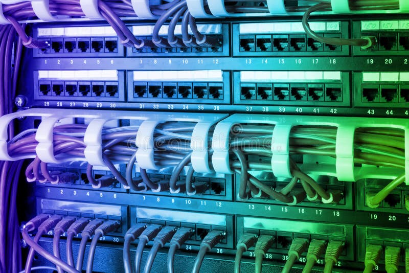 Network panel, switch and internet cable in data center. Black switch and blue ethernet cables, Data Center Concept. stock images