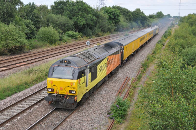 One of Network Rail`s test trains is seen top-and-tailed by Colas Rail Class 67 diesel-electric locomotives with 67023 &named Stella&#x29; leading and 67027 &#x28;named Charlotte&#x29; on the rear as it powers past North Stafford Junction between Derby and Burton-on-Trent on 16 July 2019. The infrastructure monitoring train uses Plain Line Pattern Recognition PLPR technology to monitor the status of the track and inform when maintenance or intervention is required.