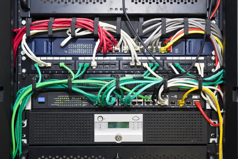 Network server cable management. The color coded and neatly bracketed cables for network and telecommunications in an high tech server configuration Network server cable management. The color coded and neatly bracketed cables for network and telecommunications in an high tech server configuration