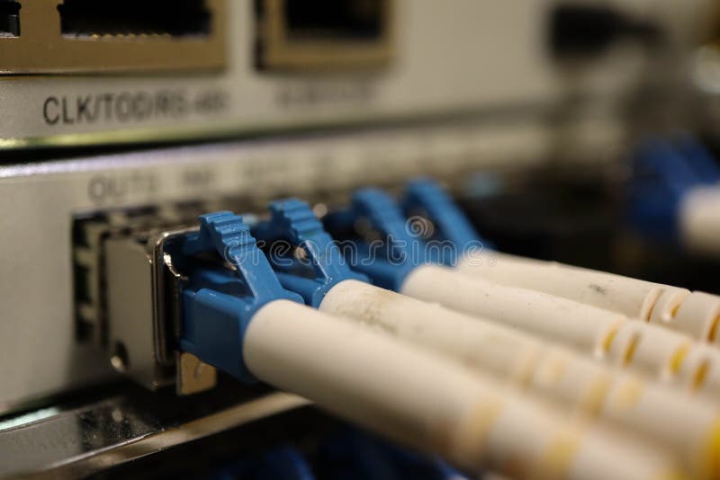 Network switch with fiber optic cables closeup royalty free stock photos