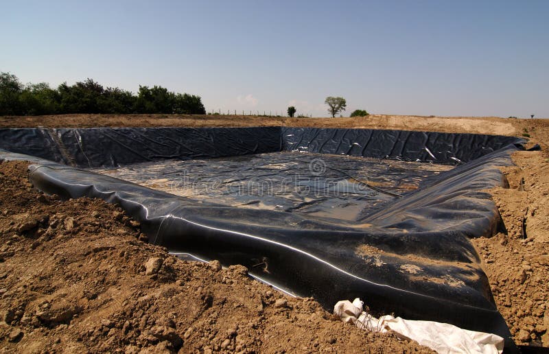 Empty new landfill with plastic isolating layer. Empty new landfill with plastic isolating layer