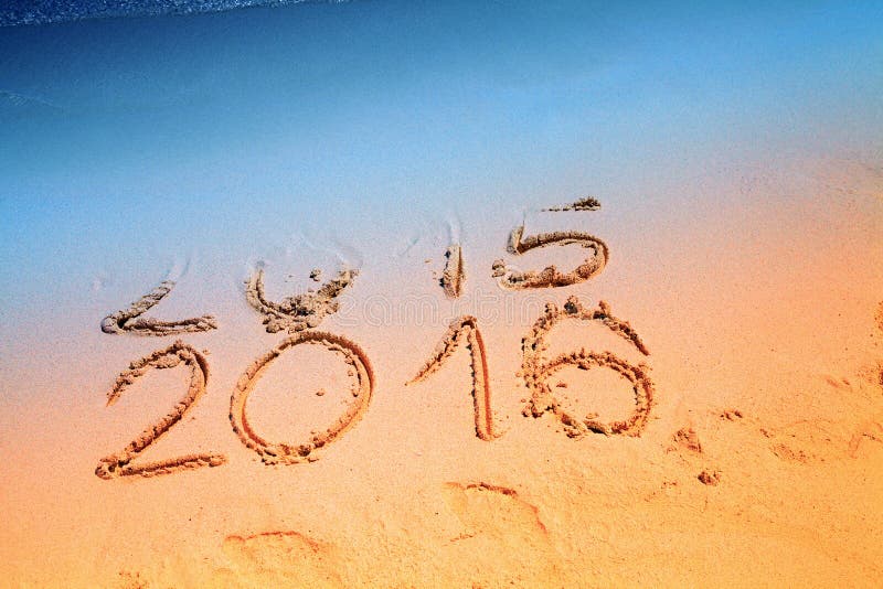 New Year 2016 replace 2015 concept writing sand on the sea beach. New Year 2016 replace 2015 concept writing sand on the sea beach