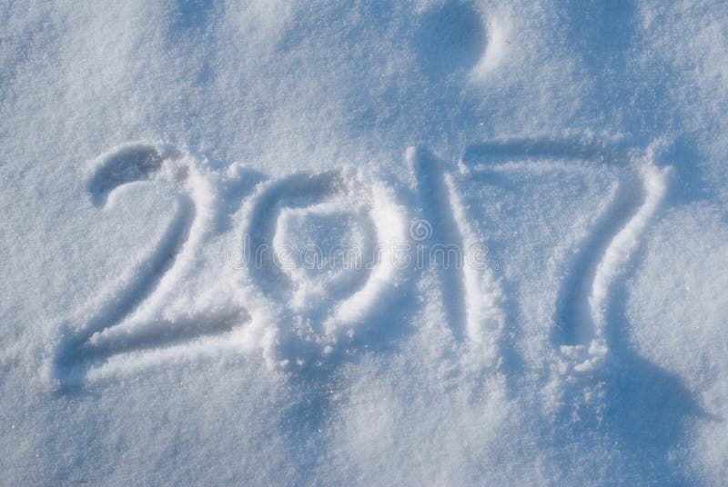 2017 new year`s greetings, footprints in the snow, New year 2017, the numbers on the snow. 2017 new year`s greetings, footprints in the snow, New year 2017, the numbers on the snow