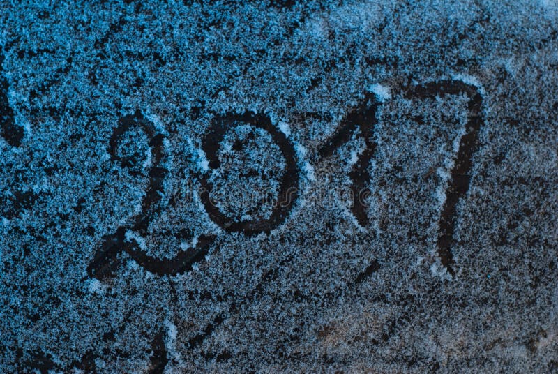 2017 new year`s greetings, footprints in the snow, New year 2017, the numbers on the snow. 2017 new year`s greetings, footprints in the snow, New year 2017, the numbers on the snow