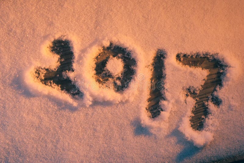 2017 new year`s greetings, footprints in the snow, New year 2017, the numbers on the snow. 2017 new year`s greetings, footprints in the snow, New year 2017, the numbers on the snow