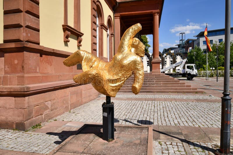 Neustadt an der Weinstrasse, Germany - August 2022: gilded bronze sculpture called 'Hambacher Vorbotin. Neustadt an der Weinstrasse, Germany - August 2022: gilded bronze sculpture called 'Hambacher Vorbotin