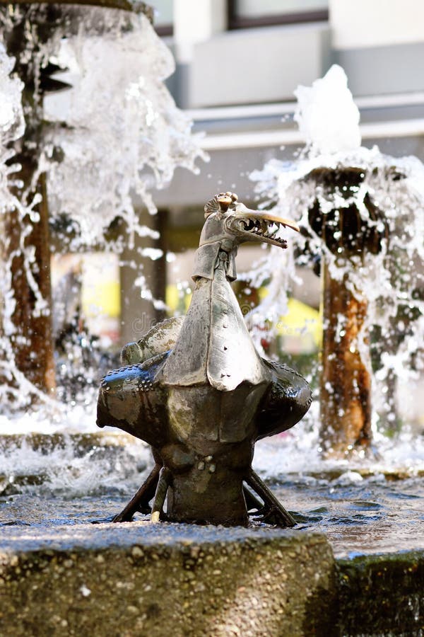 Neustadt an der Weinstrasse, Germany - August 2022: Sculpture at 'Elwedritsche Brunnen' fountain. Elwedritsche are a mythical creature mix of chickens, ducks, geese, goblins and elves from Palatinate. Neustadt an der Weinstrasse, Germany - August 2022: Sculpture at 'Elwedritsche Brunnen' fountain. Elwedritsche are a mythical creature mix of chickens, ducks, geese, goblins and elves from Palatinate