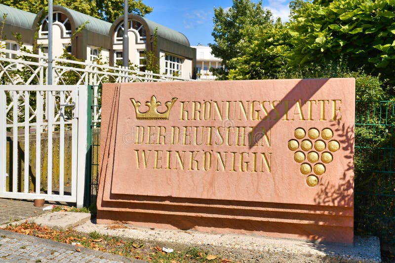 Neustadt an der Weinstrasse, Germany - August 2022: Sign saying 'Coronation city of German wine queen', a representative of the German wine industry. Neustadt an der Weinstrasse, Germany - August 2022: Sign saying 'Coronation city of German wine queen', a representative of the German wine industry