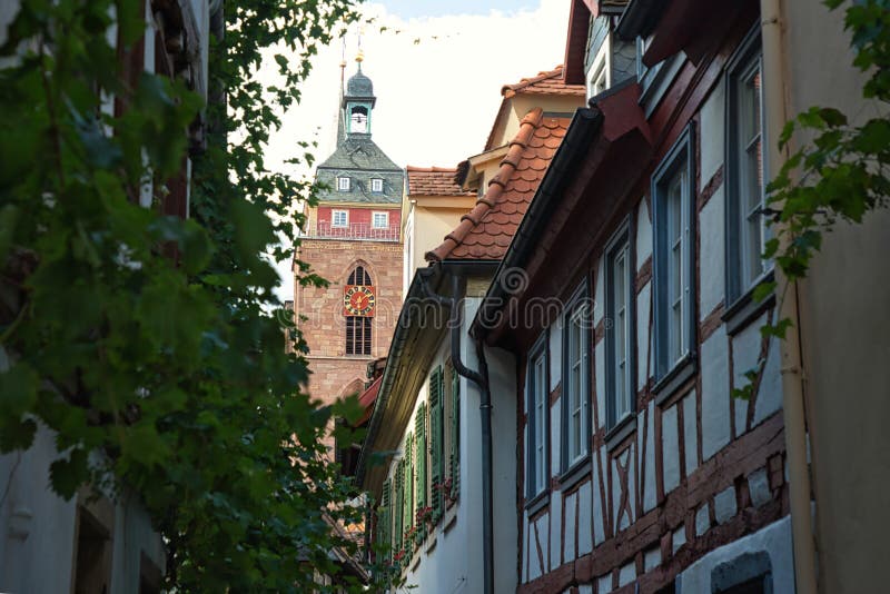 Neustadt an der Weinstrasse - The tower of the Stiftskirche St. Ägidius over half-timbered houses of the old town. royalty free stock images Neustadt an der Weinstrasse - The tower of the Stiftskirche St. Ägidius over half-timbered houses of the old town. royalty free stock images