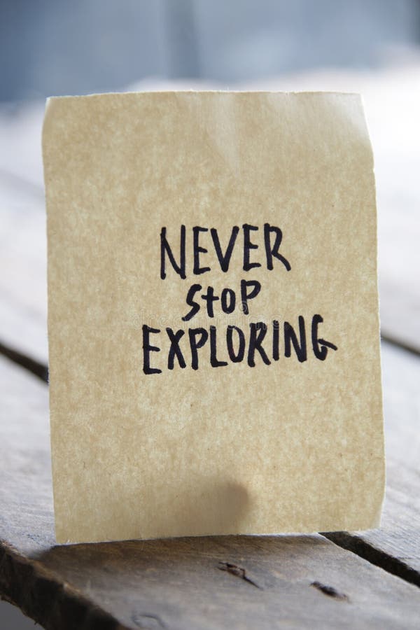 Never Stop Exploring Concept. Motivational Quotes Inscription on a Tag