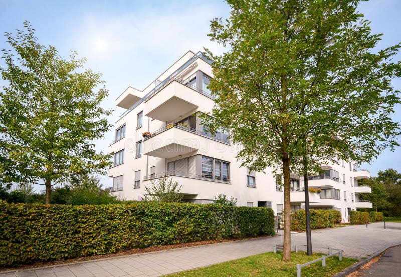 New apartment building, modern residential development with outdoor facilities in a green urban settlement