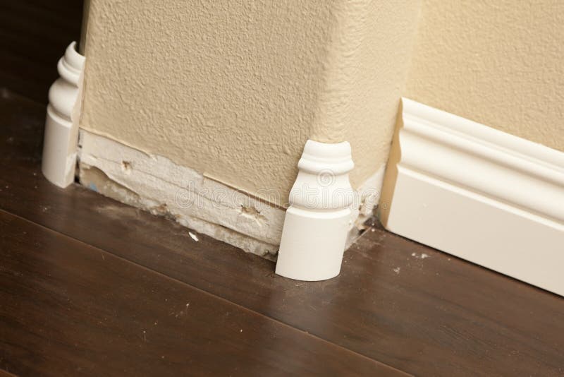 New Baseboard and Bull Nose Corners with Laminate Flooring Stock Photo