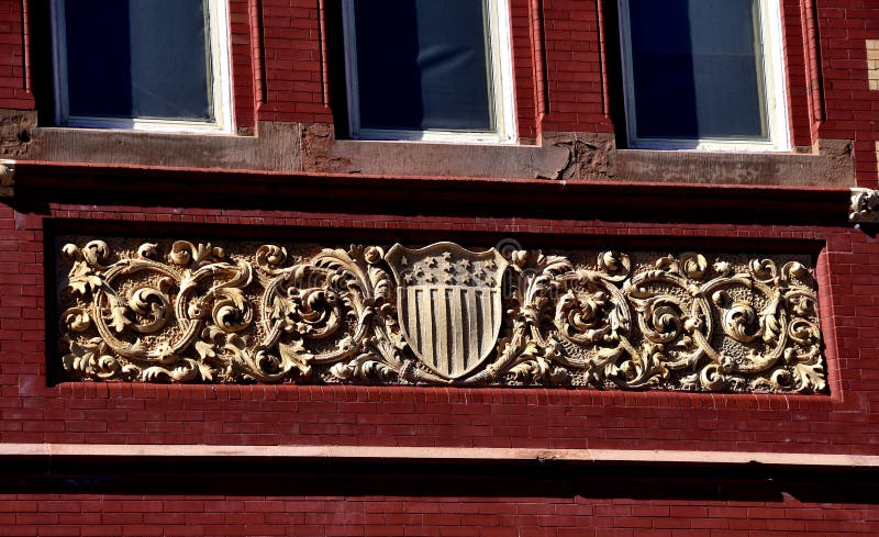 New Bern, North Carolina: Bas relief coat of arms and crest on the west front of Swiss-inspired New Bern City Hall. New Bern, North Carolina: Bas relief coat of arms and crest on the west front of Swiss-inspired New Bern City Hall