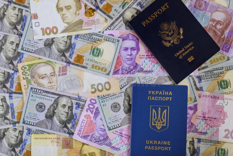 New blue Ukrainian electronic passport of dual citizens and American passpor let Ukrainian hryvna, American dollar bill stock image New blue Ukrainian electronic passport of dual citizens and American passpor let Ukrainian hryvna, American dollar bill stock image
