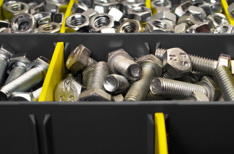 New Bolts and Nuts in Containers, Closeup Stock Photo Image of