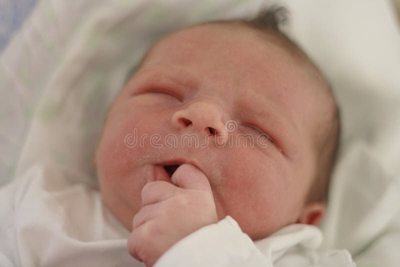 Detailed face of baby boy sucking his thumb. Detailed face of baby boy sucking his thumb.