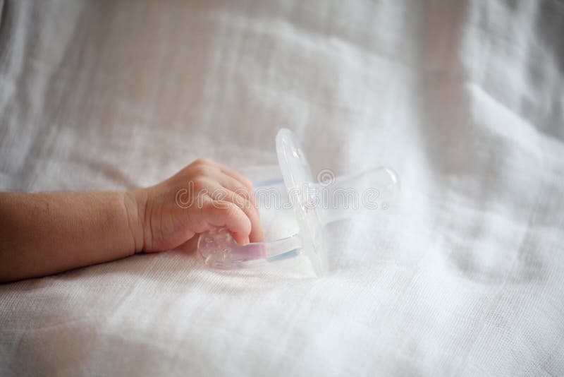 New Born Baby Hand Holding Pacifier Stock Image Image of delicacy