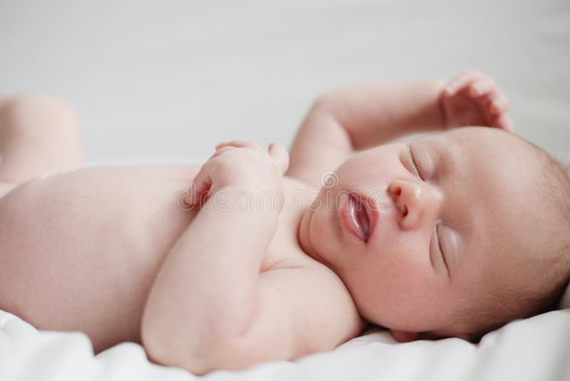 New born baby holding mom's hand. stock photo