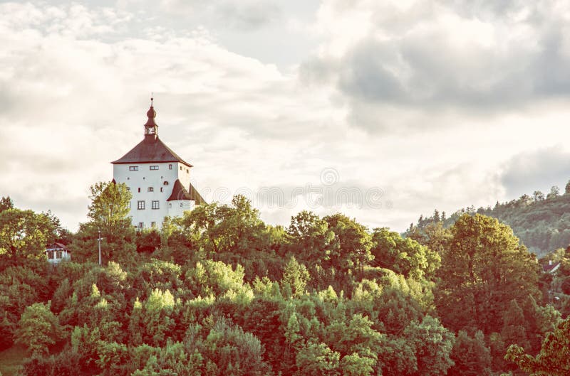 New Castle with forest in sunset, Banska Stiavnica, yellow filter