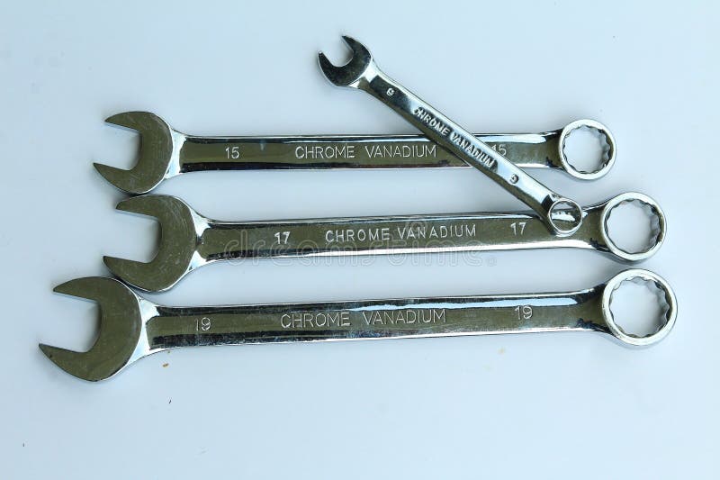 New chrome vanadium wrenchs on white background. Tools for plumbers and motor vehicle mechanics. stock photography