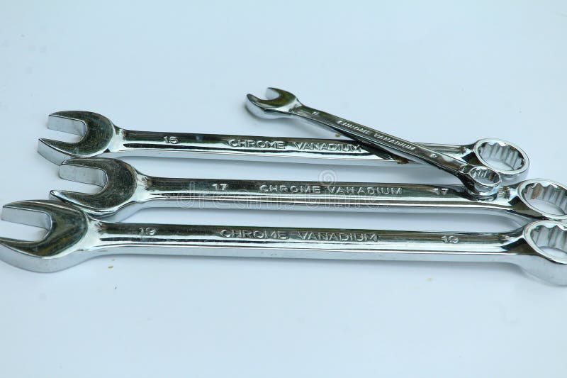 New chrome vanadium wrenchs on white background. Tools for plumbers and motor vehicle mechanics. royalty free stock photos