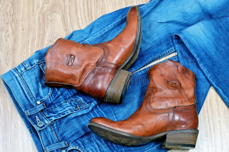 Leather Brown Cowboy Boots and Belt on Blue Jeans Stock Photo Image