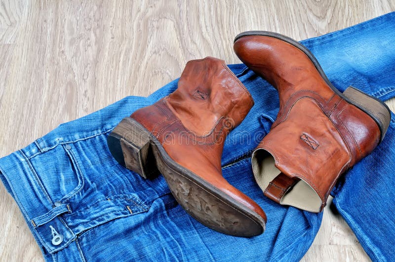 Brown Cowboy Boots on Blue Jeans Stock Photo - Image of clothing, denim ...