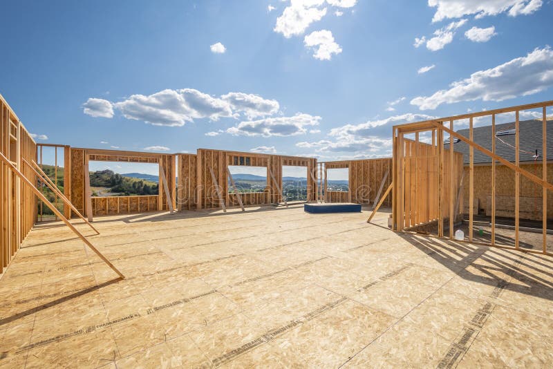 A new construction home framed with no roof or walls at a hilltop upscale subdivision stock photo A new construction home framed with no roof or walls at a hilltop upscale subdivision stock photo