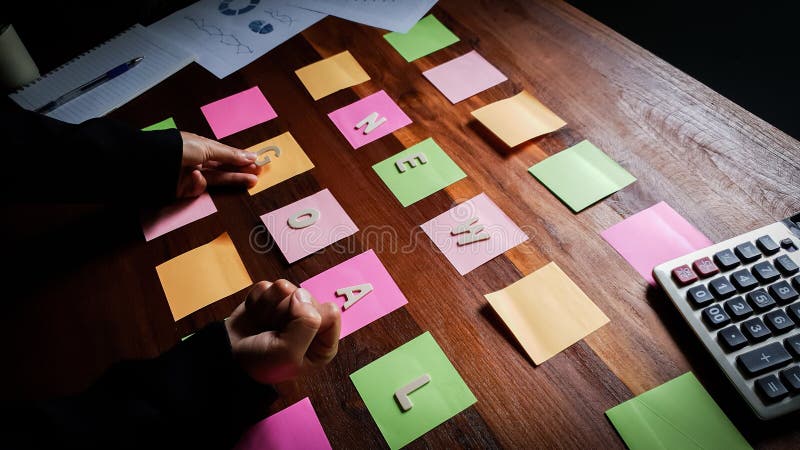 New goal Start up. Business man in black suit meeting at home office and using notes paper share design planning brainstorming brainstorm idea on desktop wood table, board, casual, coach, collaboration, colleagues, color, concept, creative, designer, focus, glass, group, ideas, indoors, job, news, pen, people, post, professional, research, showing, standing, startup, sticky, strategy, team, teamwork, thinking, together, training, woman, workshop, writing. Notes office stock images, royalty-free photos and pictures