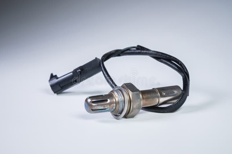 New on a grey gradient background sensor oxygen lambda probe the car`s exhaust system stock images
