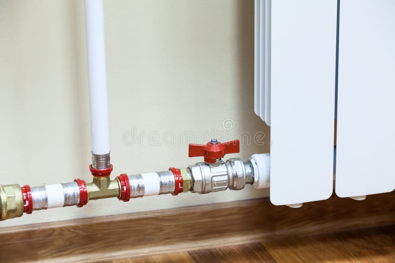 New installed central heating radiator with valve royalty free stock image New installed central heating radiator with valve royalty free stock image