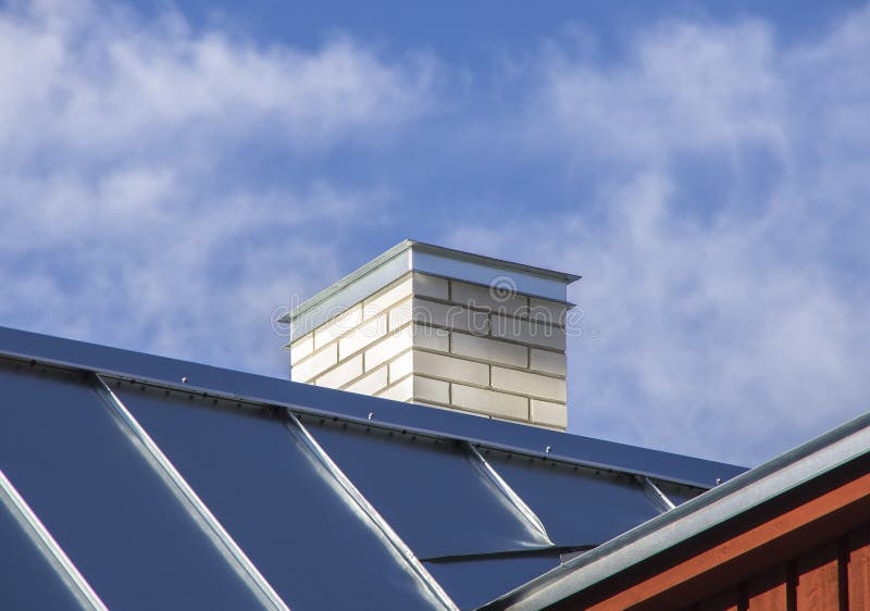 New metal roof with white chimney stock photography New metal roof with white chimney stock photography