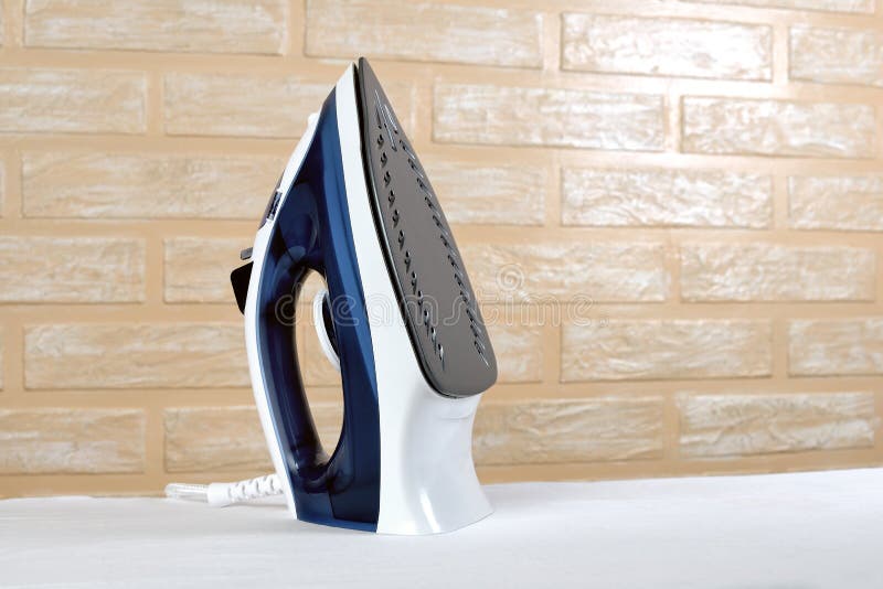 New Modern Electric Steam Iron on Ironing Board Stock Image Image of