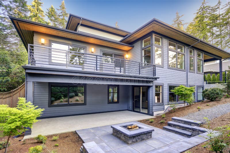 New modern home features a backyard with patio royalty free stock photo