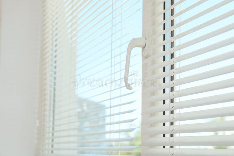 New modern window with blinds indoors stock photos