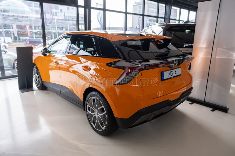 New orange Car MG4 Electric, Motor UK Limited Nanjing, high-performance Automobile in showroom, sustainable development EV, Innovation automotive industry show in Wiesbaden, Germany - January 25, 2024. Development ev stock images, royalty-free photos and pictures