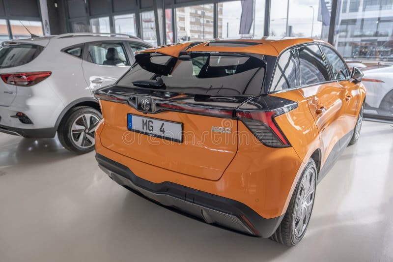 New orange Car MG4 Electric, Motor UK Limited Nanjing, high-performance Automobile in showroom, sustainable development EV, Innovation automotive industry show in Wiesbaden, Germany - January 25, 2024. Development ev stock images, royalty-free photos and pictures