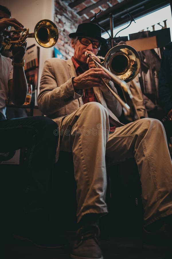 KRAKOW, POLAND - JULY 1, 2018: People celebrate New Orleans Jazz Sunday. Lot of musicians, swing dancers, vintage cars are there. KRAKOW, POLAND - JULY 1, 2018: People celebrate New Orleans Jazz Sunday. Lot of musicians, swing dancers, vintage cars are there.