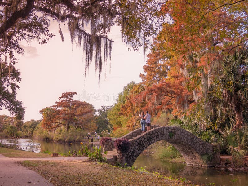 New Orleans, Louisiana, USA. December 2019. Couple take a pose in the beautiful City Park during the sunset