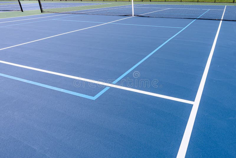 New Outdoor Blue Tennis Court with White Lines Combined with Light Blue New Outdoor Blue Tennis Court with White Lines Combined with Light Blue