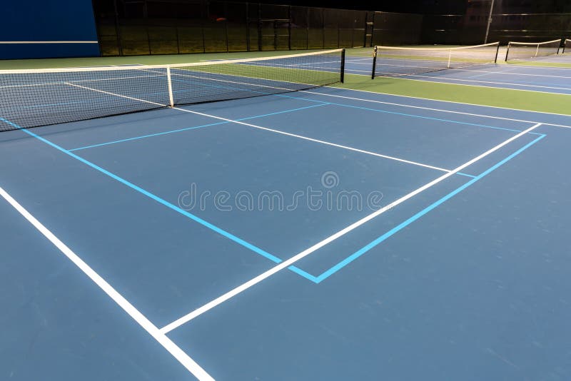 New Outdoor Blue Tennis Court with White Lines Combined with Light Blue New Outdoor Blue Tennis Court with White Lines Combined with Light Blue