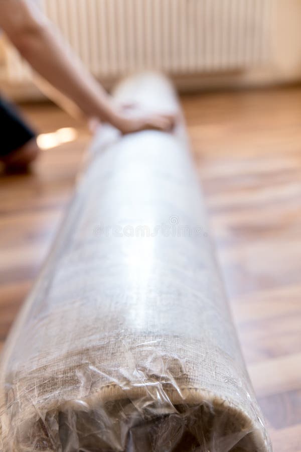New Packed and Rolled Carpet on the Floor Stock Photo Image of person