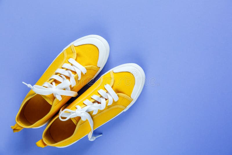 Pair Of Trendy Sport Sneakers On Yellow Background. Top View With Copy ...