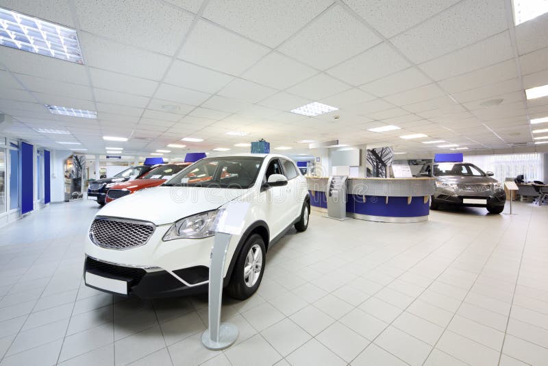 New Shining Beautiful Cars Stand Near Desk Reception Stock Image