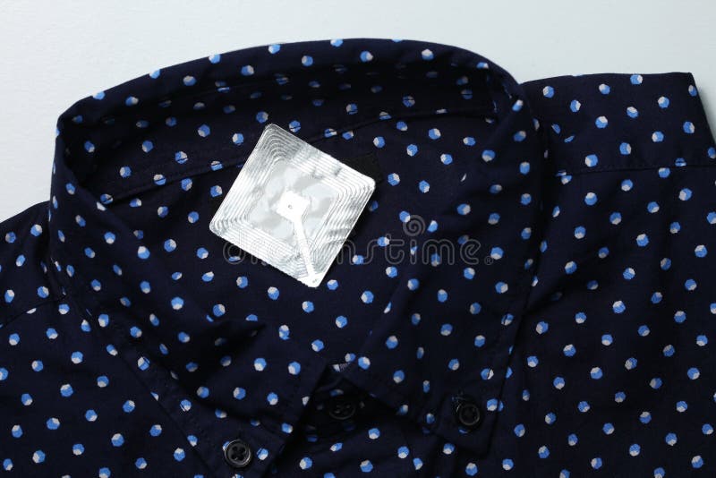 New shirt and rfid tag. stock photo. Image of alarm - 104670564