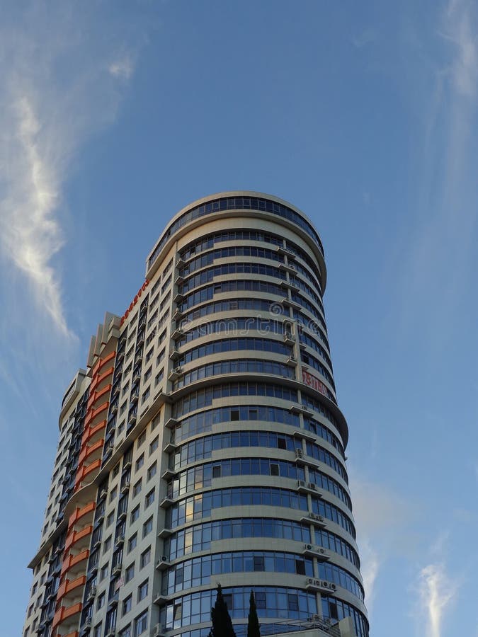 New Skyscraper Against Blue Sky Stock Image - Image of architecture : A amazing picture depicting a beautiful view. Its colors are striking and mix flawlessly. The composition is wonderful, and its particulars are also highly clear.